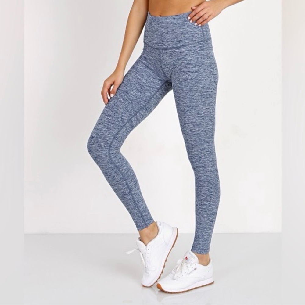 Beyond Yoga Leggings with The Bar Method printed on the right lower leg.